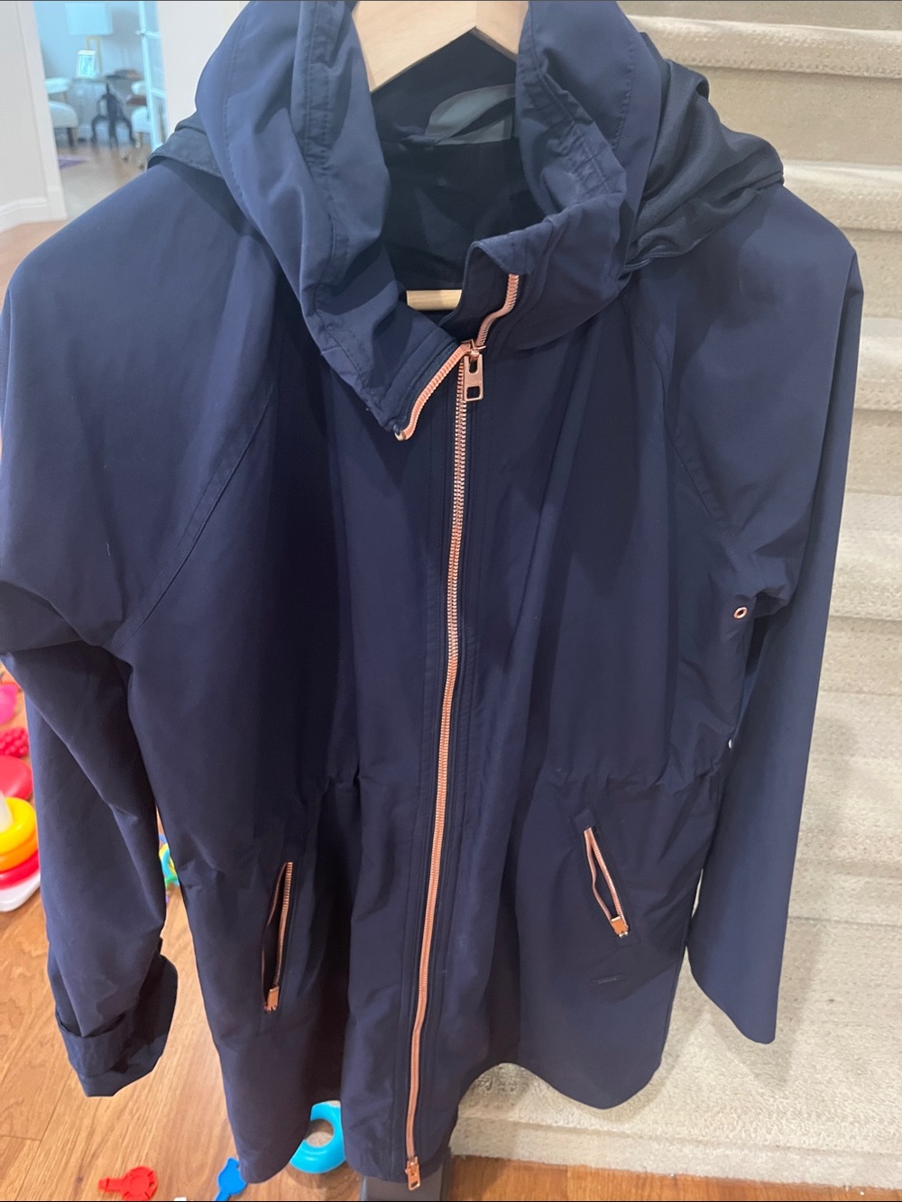 Woman’s Navy Hooded Rain Jacket with Rose Gold Trim